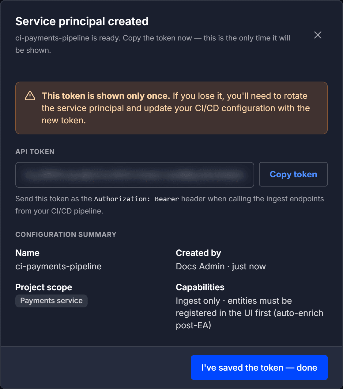 The Service principal created dialog with the token blurred